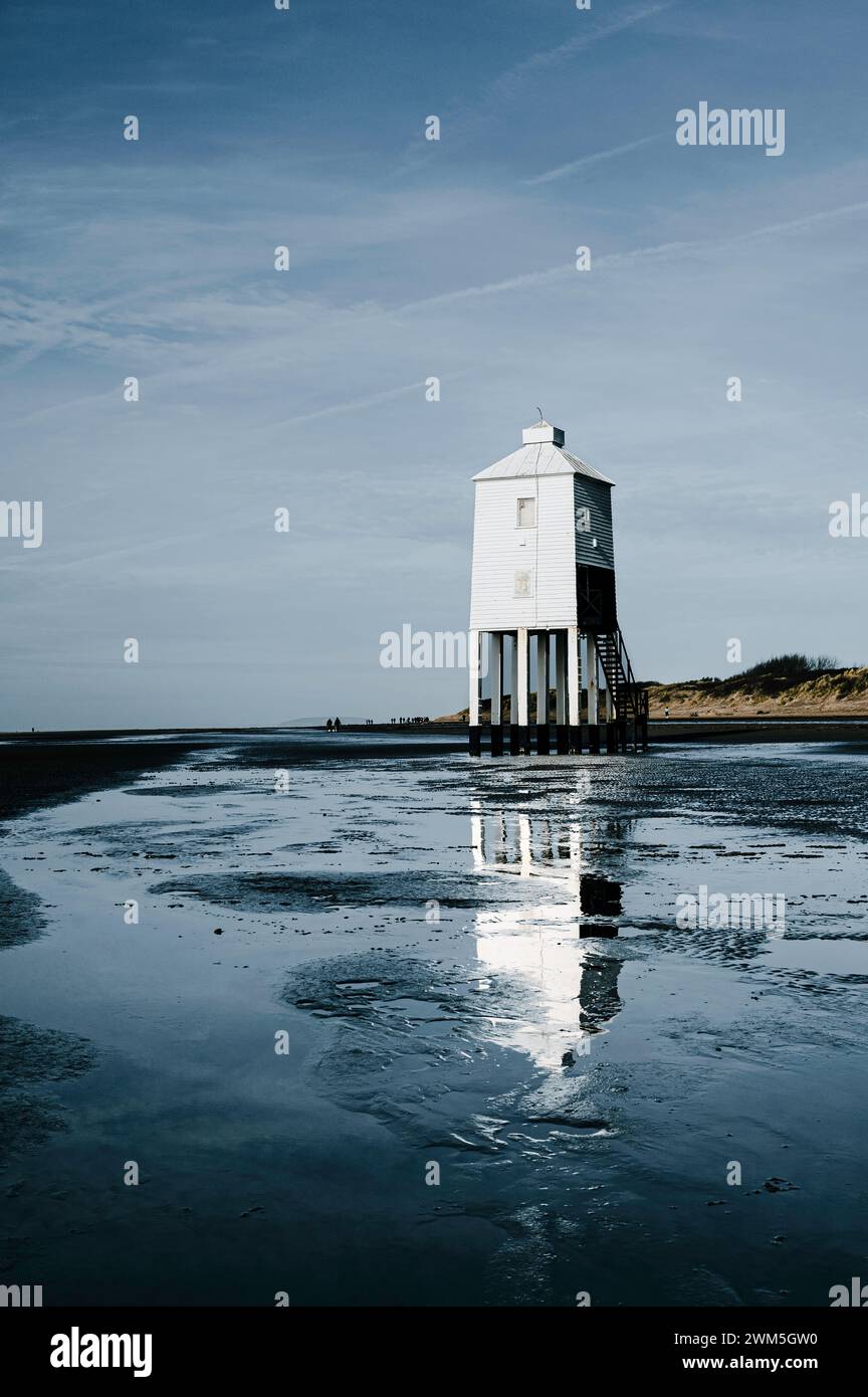 Wooden lighthouse on the shoreline Stock Photo