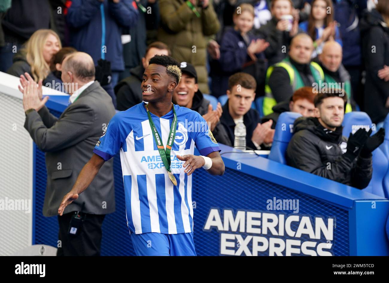 Brighton and Hove Albion's Simon Adingra wearing his Africa Cup of Nations winners medal walks out onto the pitch before the Premier League match at the American Express Stadium, Brighton. Picture date: Saturday February 24, 2024. Stock Photo