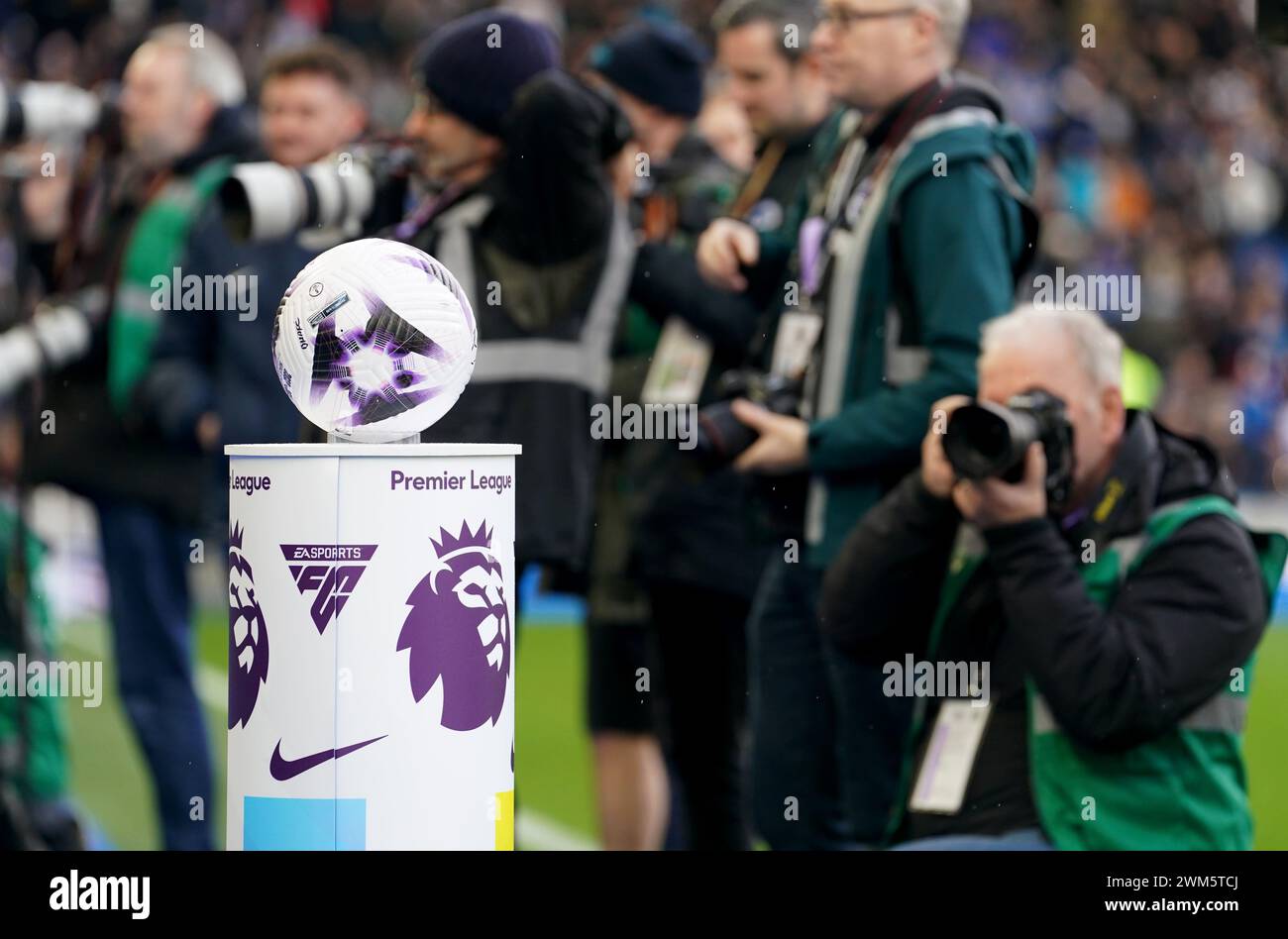 A photographer takes a picture of the match ball before the Premier League match at the American Express Stadium, Brighton. Picture date: Saturday February 24, 2024. Stock Photo