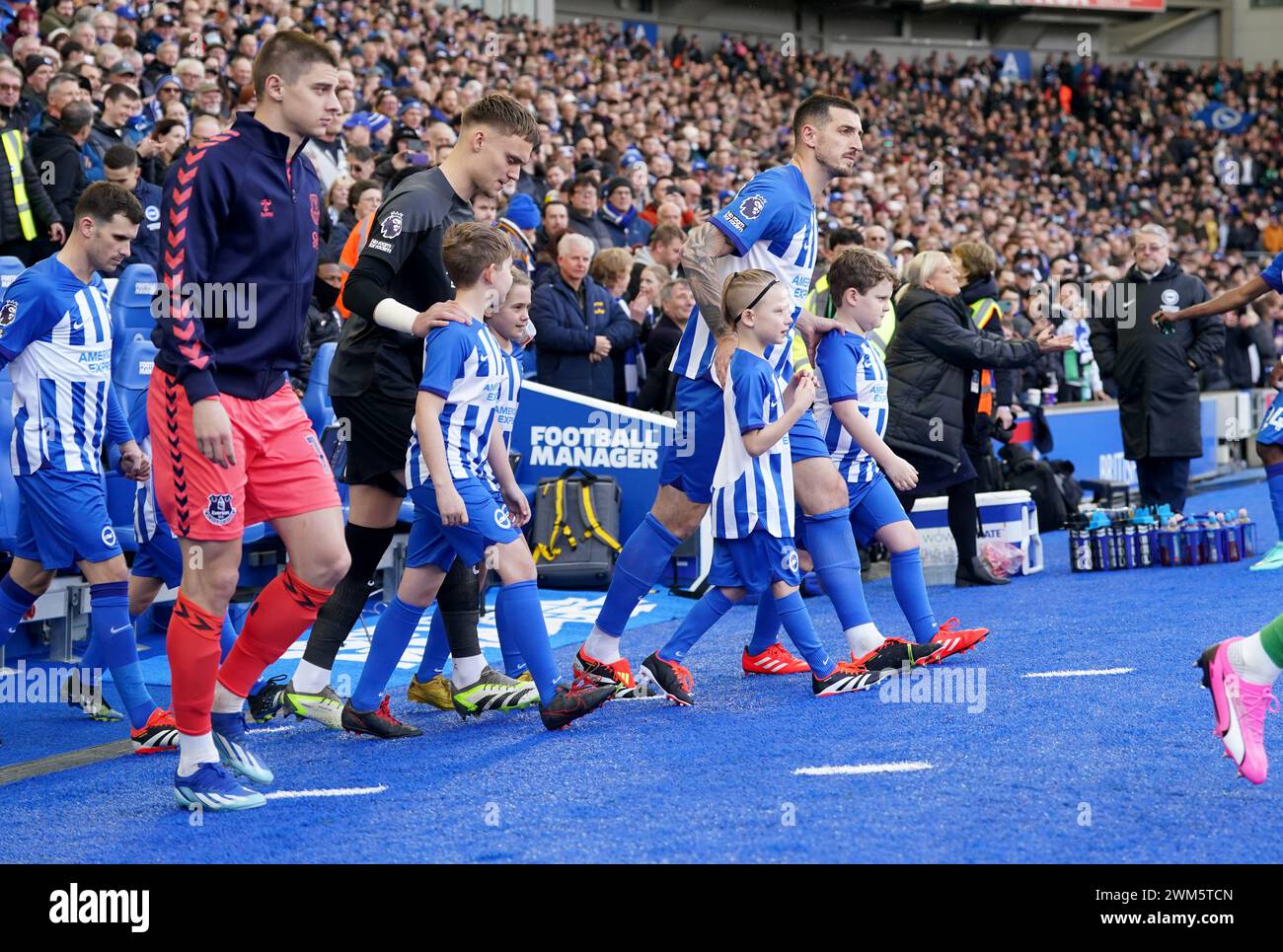 The teams walk out onto the pitch before the Premier League match at the American Express Stadium, Brighton. Picture date: Saturday February 24, 2024. Stock Photo