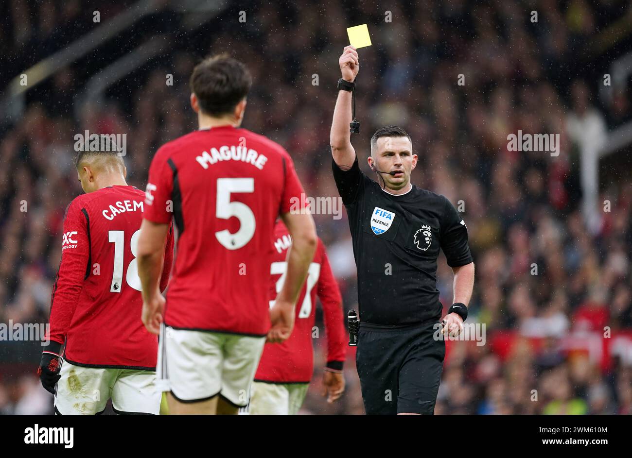 Manchester United's Harry Maguire is booked by referee Michael Oliver during the Premier League match at Old Trafford, Manchester. Picture date: Saturday February 24, 2024. Stock Photo
