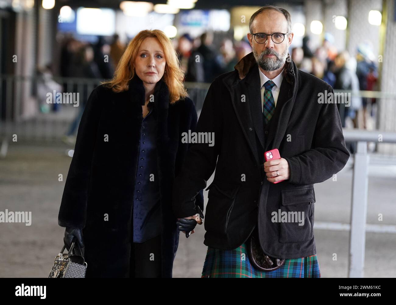 J. K. Rowling and Neil Murray arrive for the Guinness Six Nations match at the Scottish Gas Murrayfield Stadium, Edinburgh. Picture date: Saturday February 24, 2024. Stock Photo