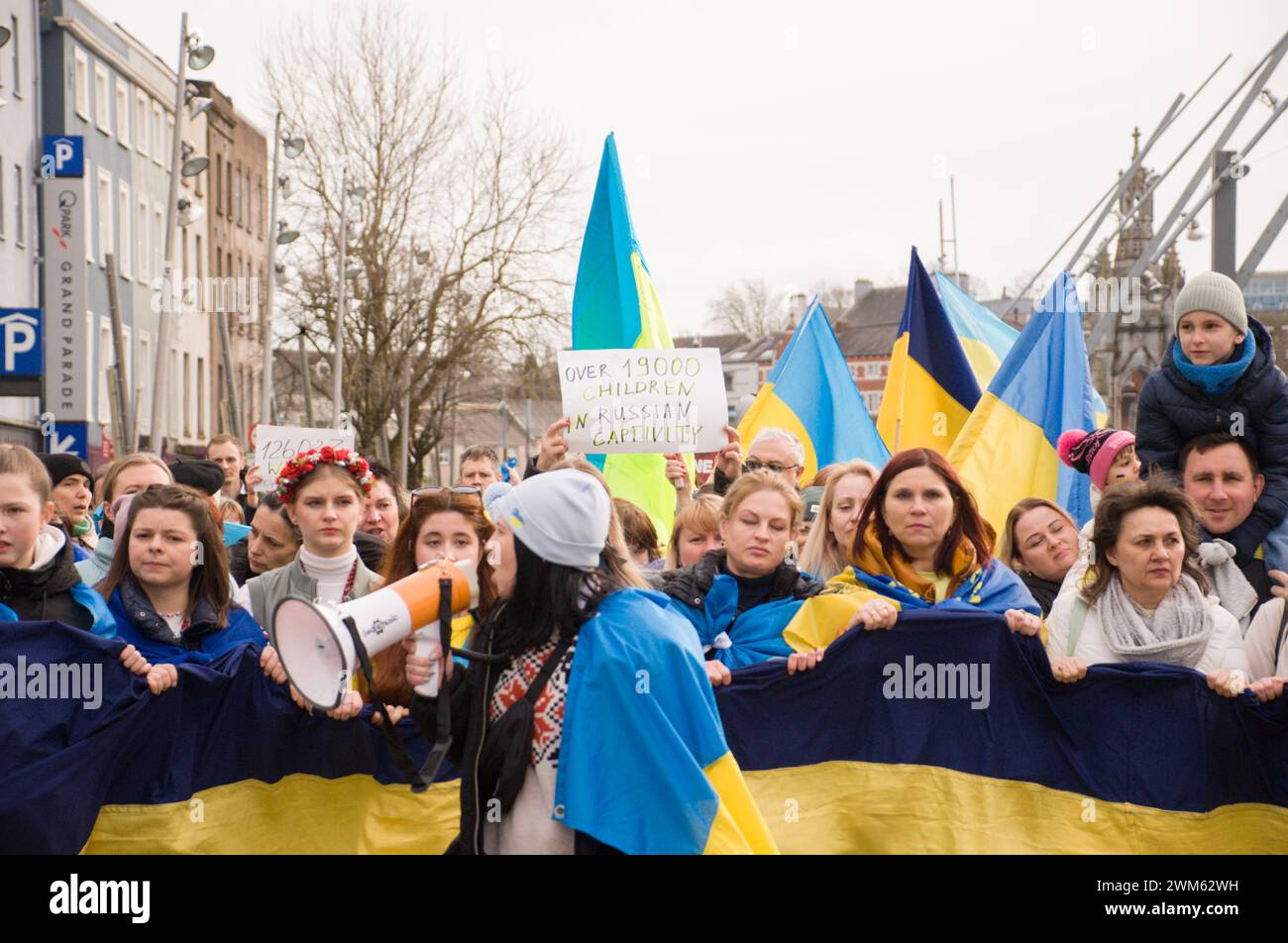 Cork, Ireland. 24th Feb, 2024. Today marks the second anniversary of the full-scale invasion of Ukraine by Russia. In response, hundreds of Ukrainians have gathered for a march in Cork City. Credit: Karlis Dzjamko/Alamy Live News Stock Photo