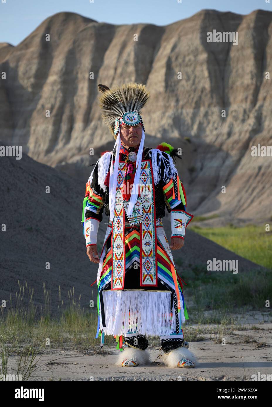 Buck Spotted Tail (Sicangu Lakota Oyate) in his Grass Dance regalia; Badlands National Park, South Dakota. Stock Photo