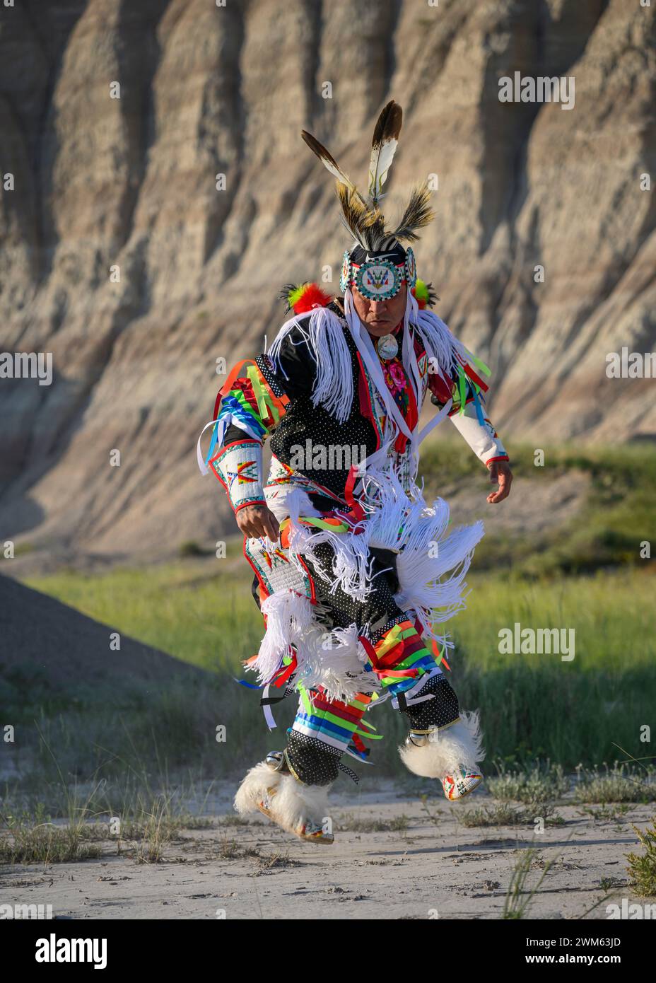 Buck Spotted Tail (Sicangu Lakota Oyate) performing his Grass Dance; Badlands National Park, South Dakota. Stock Photo