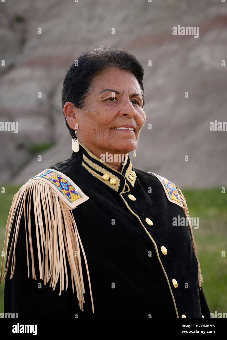 Marian Sorace wearing her military coat regalia. Badlands National Park, South Dakota. Stock Photo