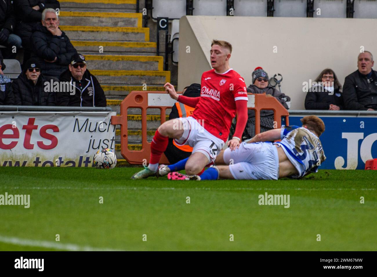 Morecambe on Saturday 24th February 2024. Grimsby Town's Denver Hume tackles Morecambe's Joel Senior during the Sky Bet League 2 match between Morecambe and Grimsby Town at the Globe Arena, Morecambe on Saturday 24th February 2024. (Photo: Ian Charles | MI News) Credit: MI News & Sport /Alamy Live News Stock Photo