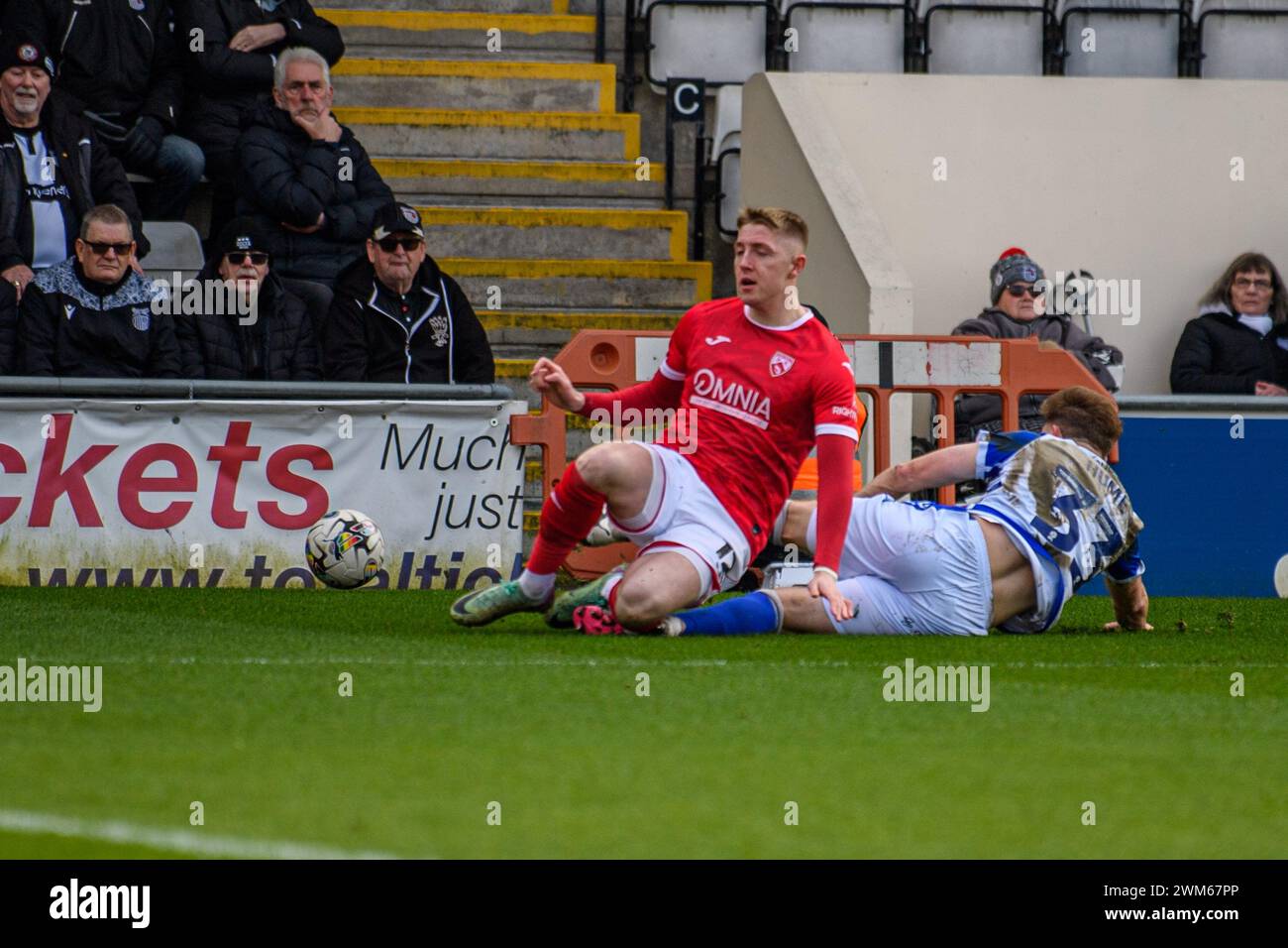 Morecambe on Saturday 24th February 2024. Grimsby Town's Denver Hume tackles Morecambe's Joel Senior during the Sky Bet League 2 match between Morecambe and Grimsby Town at the Globe Arena, Morecambe on Saturday 24th February 2024. (Photo: Ian Charles | MI News) Credit: MI News & Sport /Alamy Live News Stock Photo