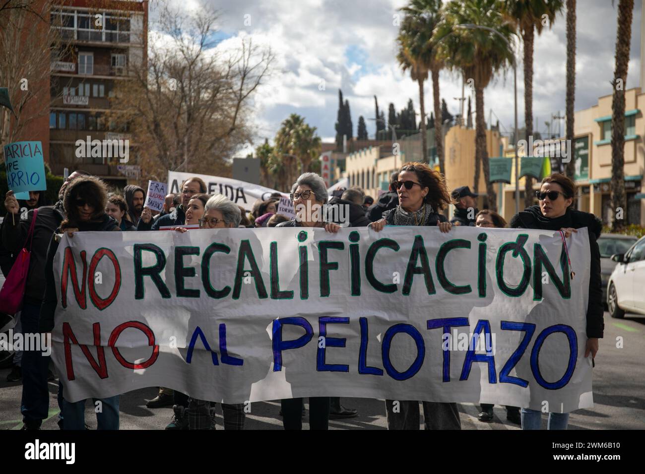 A group of protesters march with a banner during the demonstration