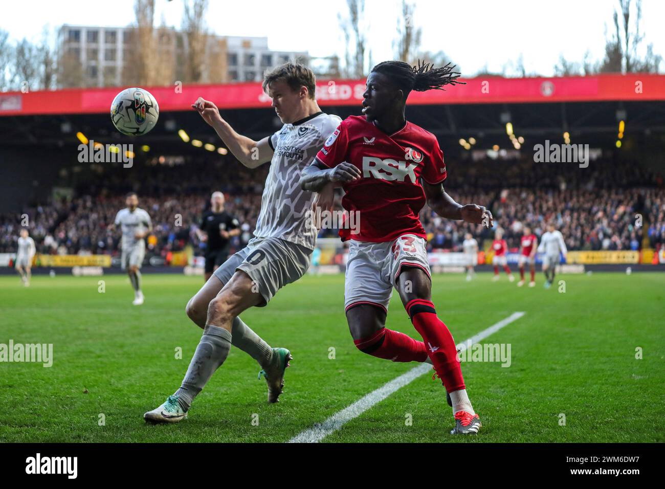 Portsmouth's Sean Raggett (left) with Charlton Athletic's Karoy Anderson during the Sky Bet League One match at The Valley, London. Picture date: Saturday February 24, 2024. Stock Photo