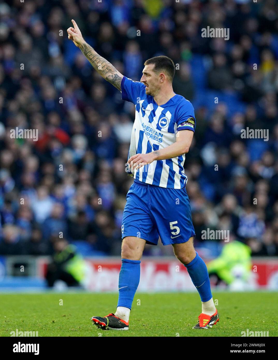 Brighton and Hove Albion's Lewis Dunk signals moments before scoring his sides equalising goal during the Premier League match at the American Express Stadium, Brighton. Picture date: Saturday February 24, 2024. Stock Photo