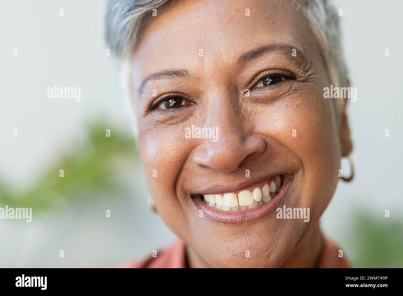 Close-up of a smiling biracial woman Stock Photo