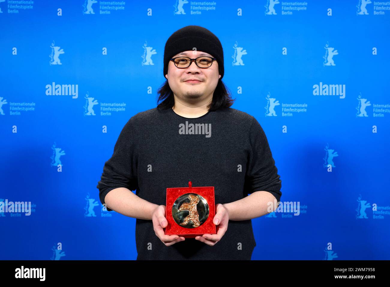 Berlin, Germany. 24th Feb, 2024. Qiu Yang poses with the Encounters Special Jury Prize for 'Some Rain Must Fall' (Kong fang jian li de nv ren) backstage during the award ceremony at the 74th Berlin International Film Festival. Credit: Nadja Wohlleben/Reuters/Pool/dpa/Alamy Live News Stock Photo