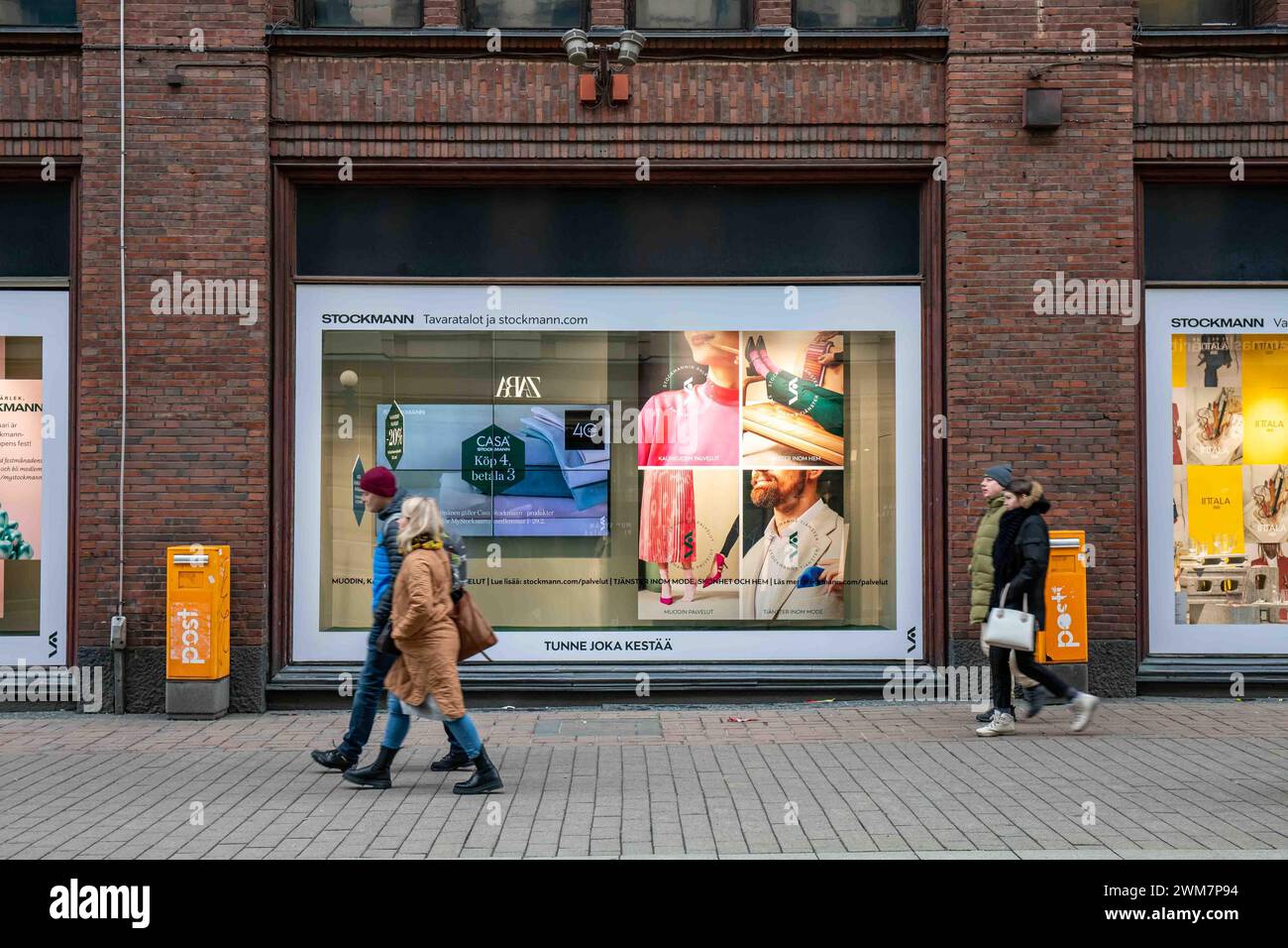 People passing Stockmann department store display window on Aleksanterinkatu in Kluuvi district of Helsinki, Finland Stock Photo