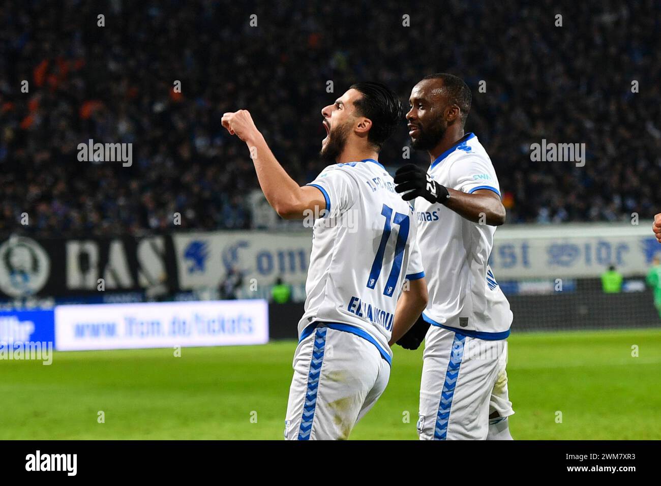 Magdeburg, Germany. 24th Feb, 2024. Soccer: Bundesliga 2, Matchday 23, 1. FC Magdeburg - FC Schalke 04, MDCC-Arena. The Magdeburg players celebrate after the 2:0 goal by Mohammed El Hankouri (l) of Magdeburg. Credit: Christophe Gateau/dpa - IMPORTANT NOTE: In accordance with the regulations of the DFL German Football League and the DFB German Football Association, it is prohibited to utilize or have utilized photographs taken in the stadium and/or of the match in the form of sequential images and/or video-like photo series./dpa/Alamy Live News Stock Photo
