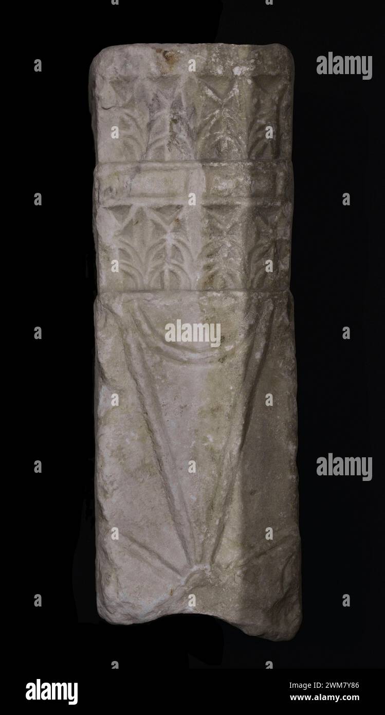 Altar support. Fragment of the upper part, decorated with crosses pattée and topped with two friezes of acanthus leaves. Marble. 7th century. From Toledo, Spain. Museum of Visigoth Councils and Culture. Toledo, Castile-La Mancha, Spain. Stock Photo