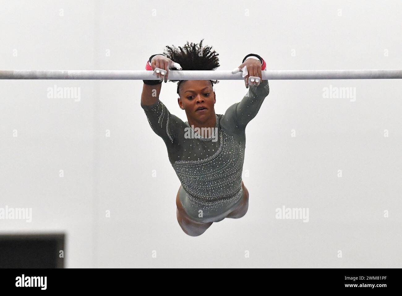 Trinity Thomas performs on the uneven bars at the USA Gymnastics Winter