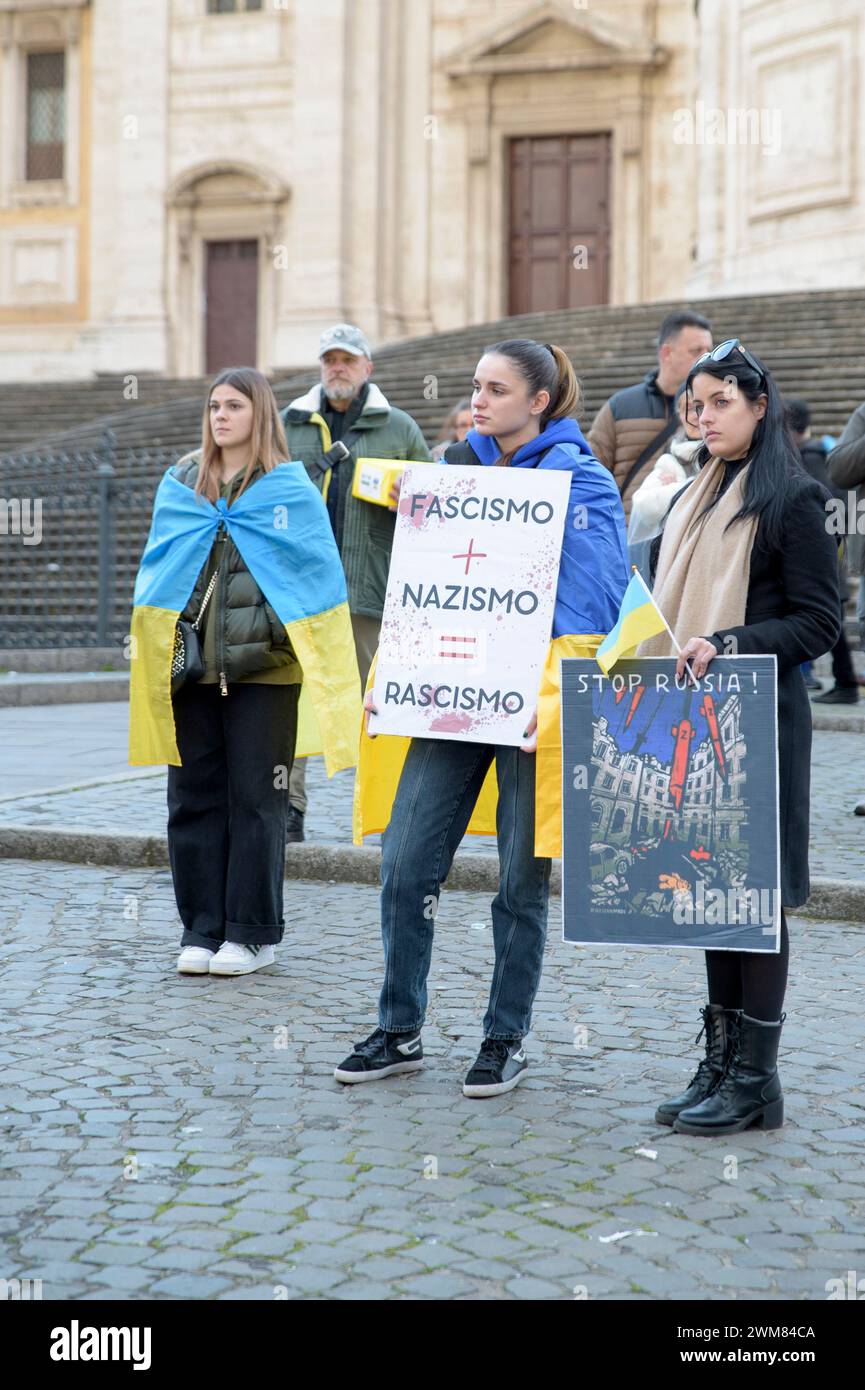 Rome, Italy. 24th Feb, 2024. Two women hold up signs with the words 'fascism nazism=rascism' and 'stop russia' during the demonstration on the occasion of the anniversary of the Russian occupation organized by the Christian Association of Ukrainians in Italy in Rome. (Credit Image: © Marcello Valeri/ZUMA Press Wire) EDITORIAL USAGE ONLY! Not for Commercial USAGE! Credit: ZUMA Press, Inc./Alamy Live News Stock Photo
