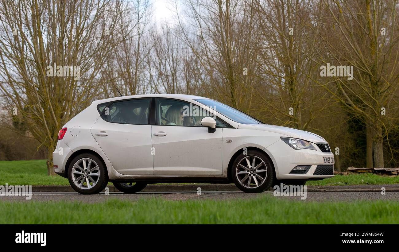Milton Keynes,UK-Feb 23rd 2024: 2015 white Seat Ibiza car driving on an English road Stock Photo