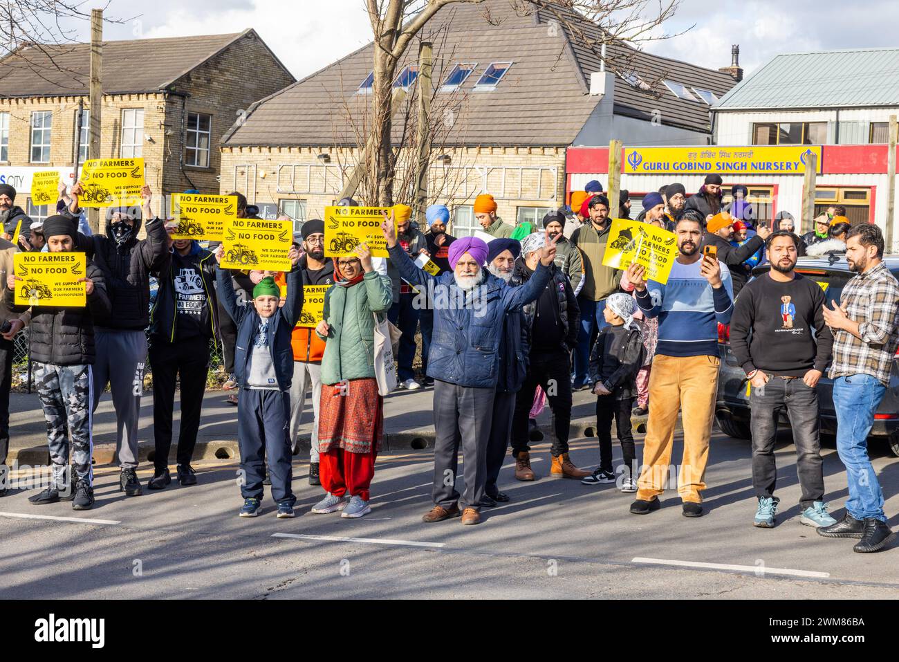 Bradford, UK. 24 FEB, 2024. People gather in Bradford in support of Saving Punjab campaign outside Guru Gobind Singh Nursery, Bradford. They hold signs saying No Farmers No Food. Credit Milo Chandler/Alamy Live News Stock Photo