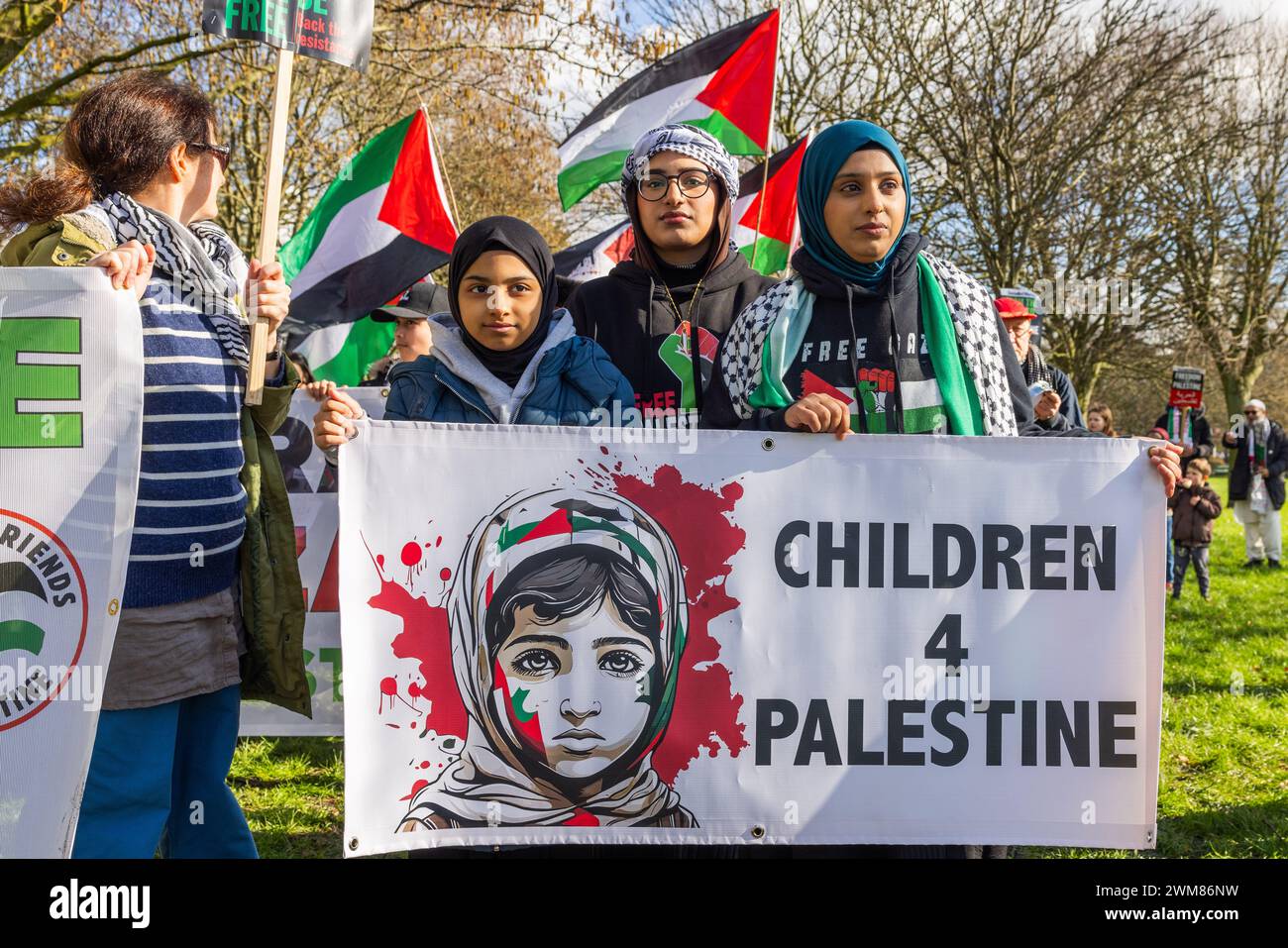 Bradford, UK. 24 FEB, 2024.  Demonstrators hold Children for Palestine sign at start of West Yorkshire for Palestine March. Gipsy ST/Leeds RD. Credit Milo Chandler/Alamy Live News Stock Photo