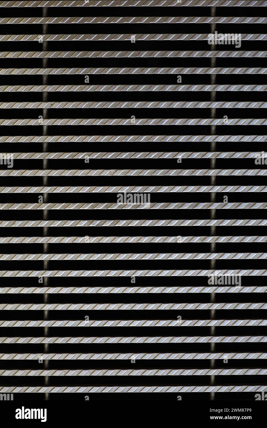 Background material photo showing a close-up of iron grating from above Stock Photo