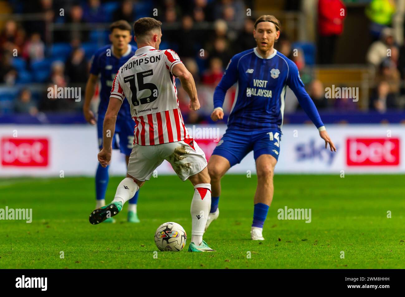 Cardiff, UK. 24th Feb, 2024. Jordan Thompson of Stoke City under pressure from Josh Bowler of Cardiff City during the EFL Skybet championship match, Cardiff City v Stoke City at the Cardiff City Stadium in Cardiff, Wales on Saturday 24th February 2024. This image may only be used for Editorial purposes. Editorial use only, pic by Credit: Andrew Orchard sports photography/Alamy Live News Stock Photo