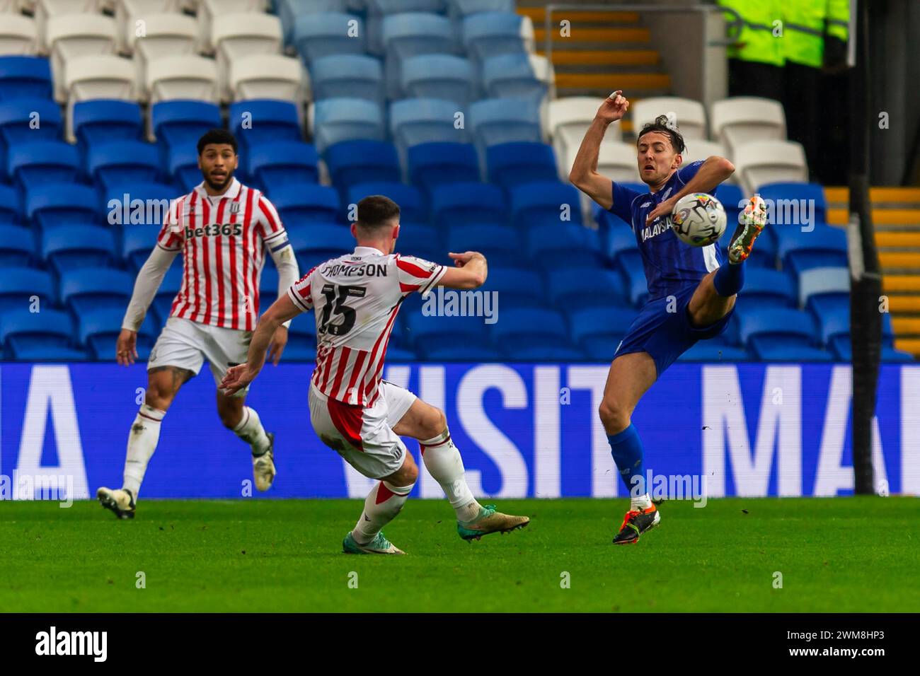 Cardiff, UK. 24th Feb, 2024. Ryan Wintle of Cardiff City tries to block the shot of Jordan Thompson of Stoke City during the EFL Skybet championship match, Cardiff City v Stoke City at the Cardiff City Stadium in Cardiff, Wales on Saturday 24th February 2024. This image may only be used for Editorial purposes. Editorial use only, pic by Credit: Andrew Orchard sports photography/Alamy Live News Stock Photo