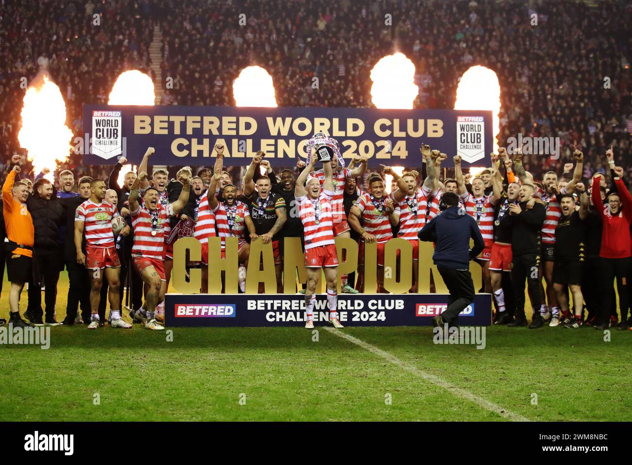 Wigan Warriors' Liam Farrell lifts the World Club Challenge trophy following the Betfred World Club Challenge match at the DW Stadium, Wigan. Picture date: Saturday February 24, 2024. Stock Photo