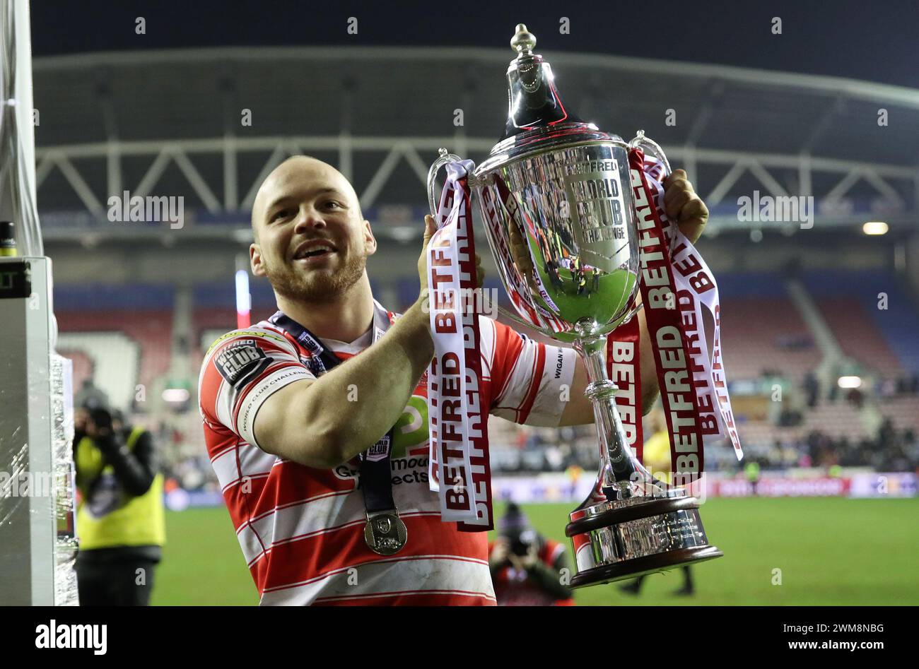 Wigan Warriors' Liam Marshall with the World Club Challenge trophy following the Betfred World Club Challenge match at the DW Stadium, Wigan. Picture date: Saturday February 24, 2024. Stock Photo