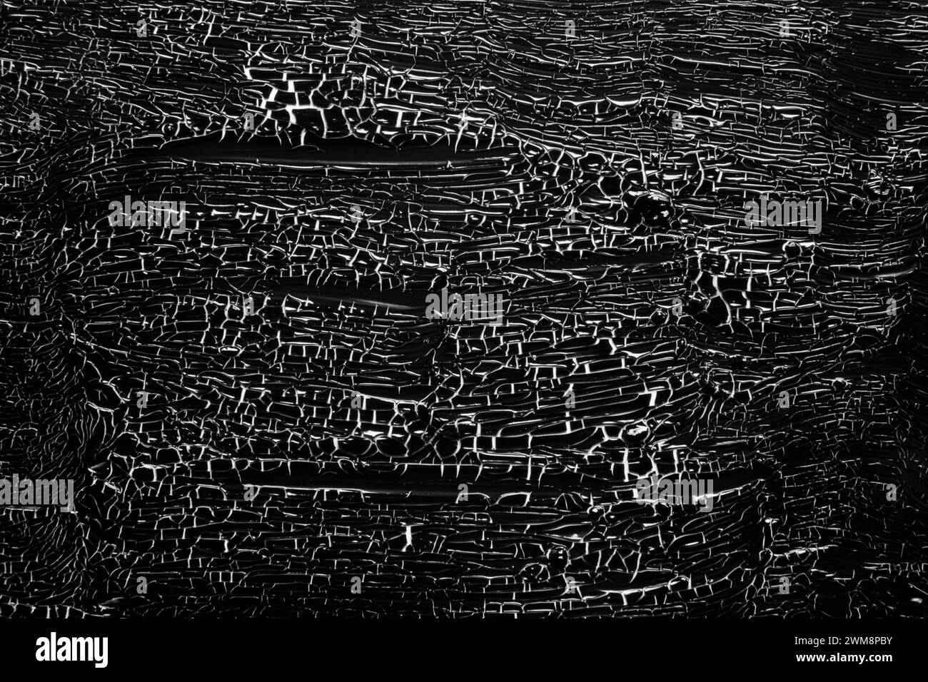 Paint crackled black on white Stock Photo