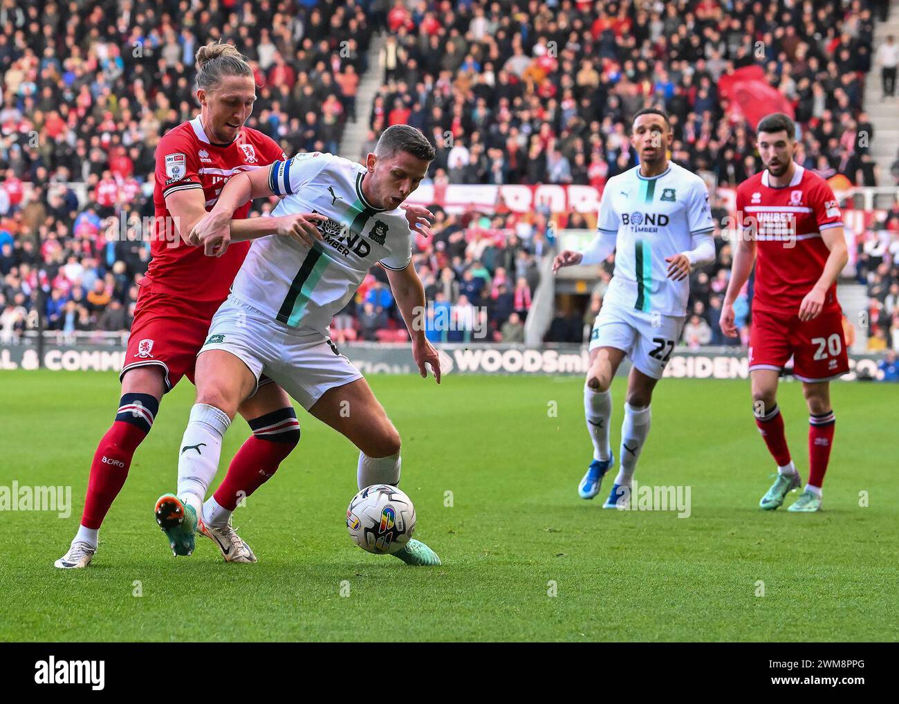 Jordan Houghton of Plymouth Argyle shields the ball from Luke Ayling of ...