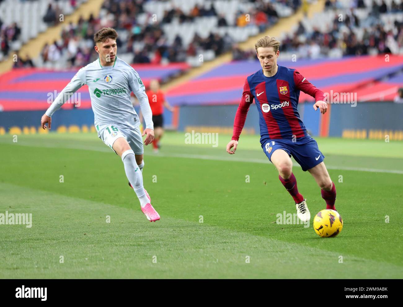 Sabadell, Barcelona, Spain. 24th Feb, 2024. Barcelona Spain 24.02.2024 Frenkie de Jong ( FC Barcelona) and Jose Angel Carmona (Getafe CF) battle for the ball during the La Liga EA Sports between FC Barcelona and Getafe CF at Estadi Olimpic Lluis Companys on 24 February 2024 in Barcelona. (Credit Image: © Xavi Urgeles/ZUMA Press Wire) EDITORIAL USAGE ONLY! Not for Commercial USAGE! Credit: ZUMA Press, Inc./Alamy Live News Stock Photo