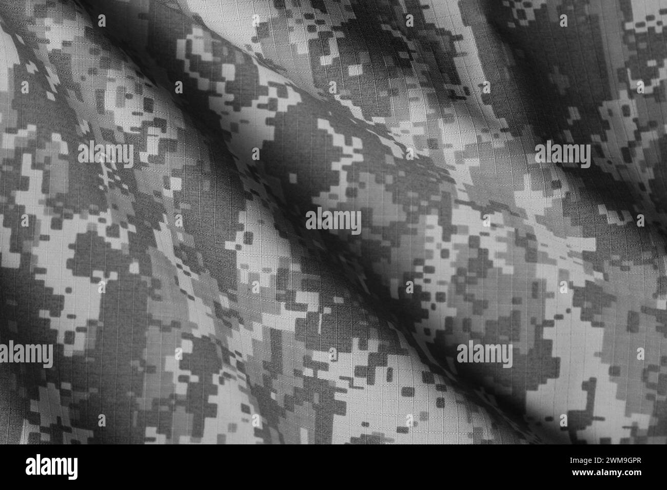 Texture of crumpled camouflage fabric as background, top view. Black and white effect Stock Photo