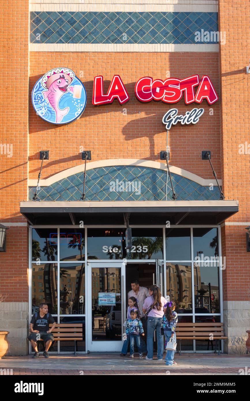 People win the doorway of La Costa Grill, a seafood restaurant with a Mexican twist, McAllen, Texas, USA. Stock Photo