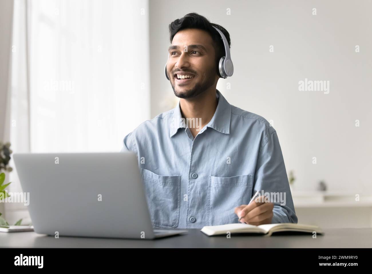 Man listening audio course improve foreign language skills using