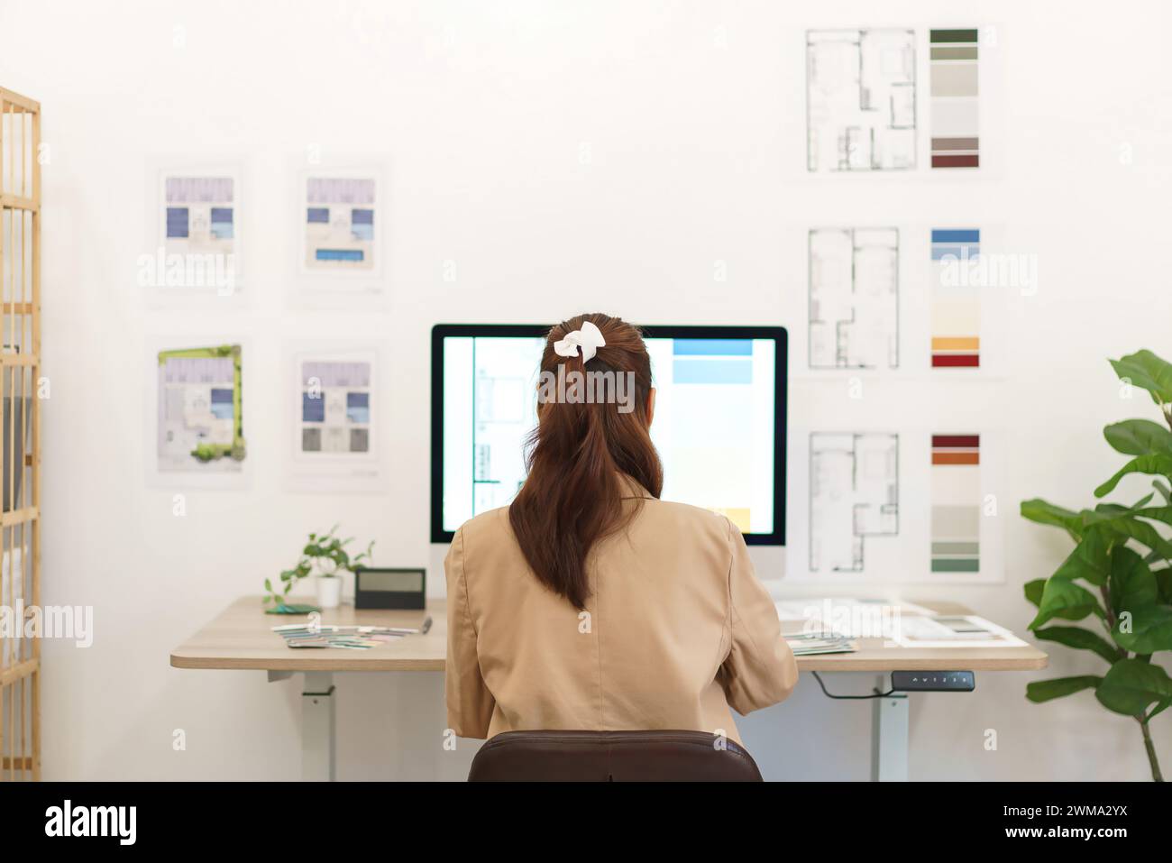 Architectural concept, Behind view female architect working about ...