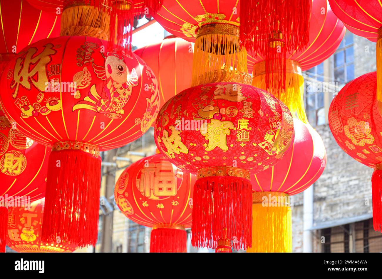 The traditional Chinese red lanterns hanging in front of people’s house ...