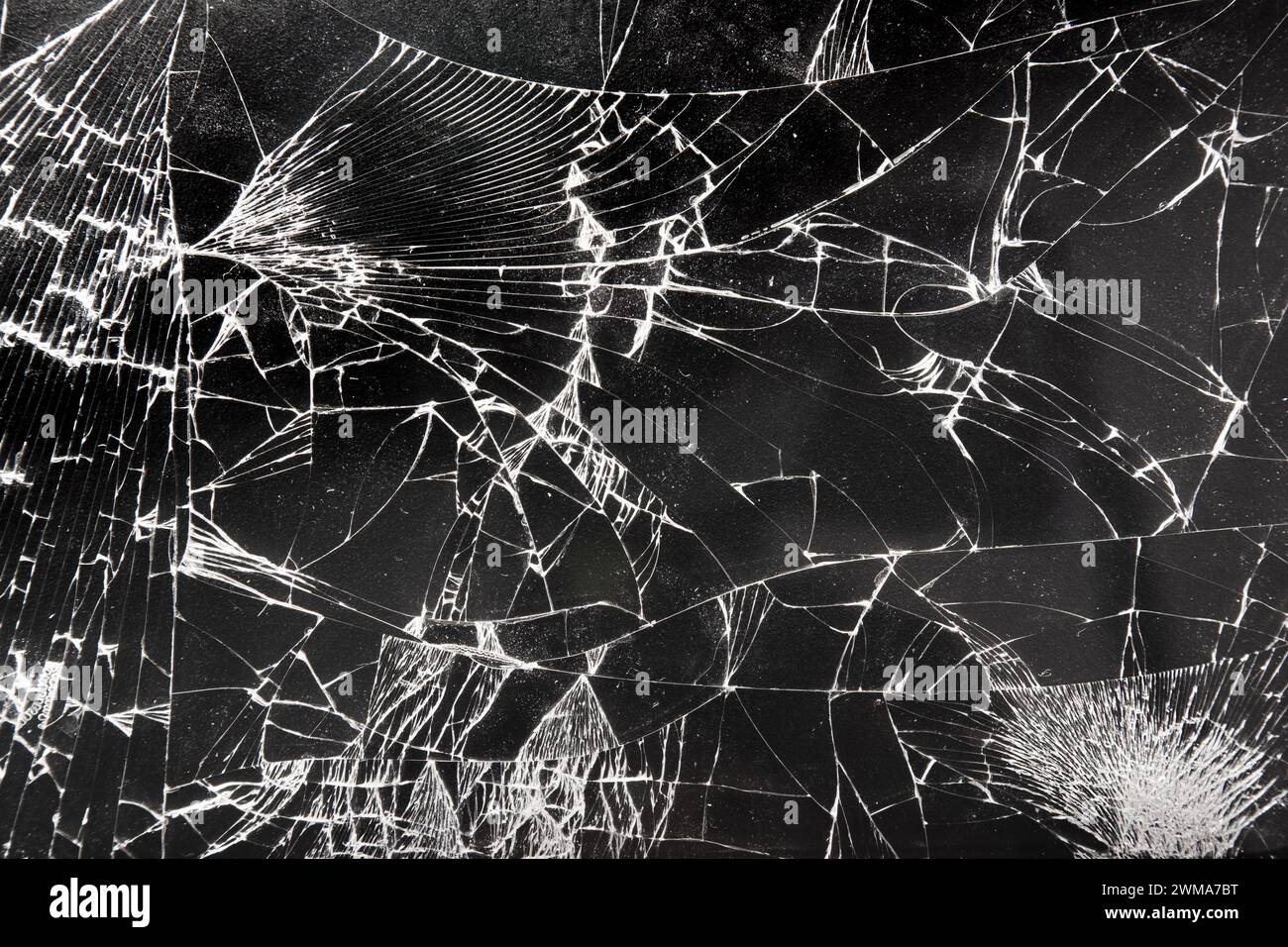 Broken glass texture on black background Stock Photo