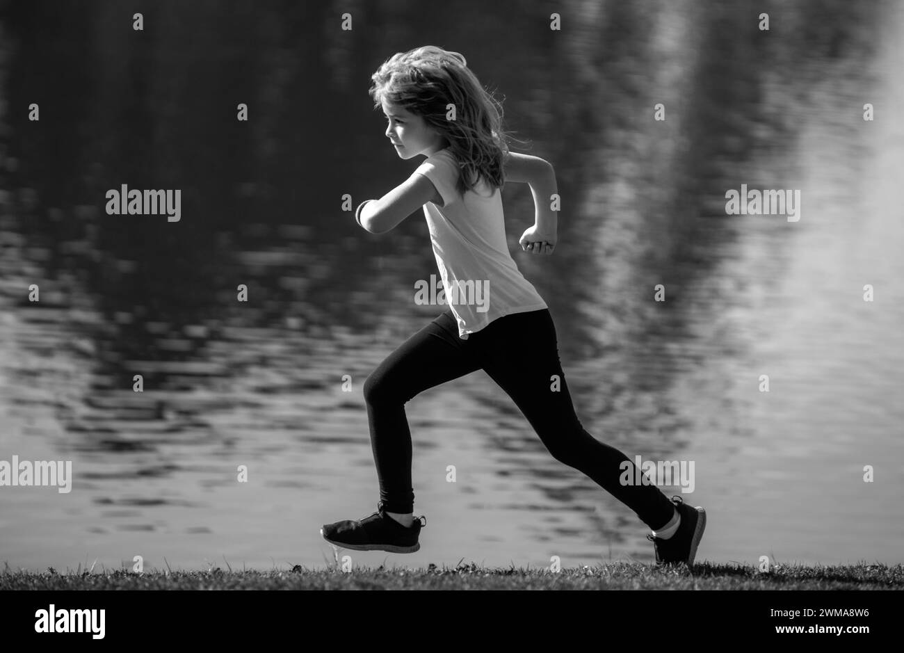 Kids jogging in park outdoor. Little boy running in nature. Active healthy child boy runner