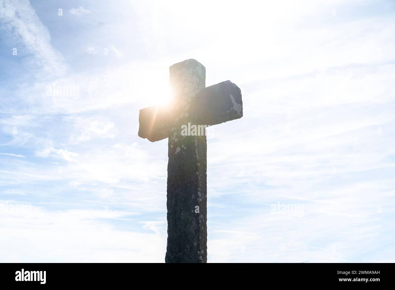 Cross at Sunset, crucifix with sun light in the background. Crucifixion Of Jesus Christ. Stock Photo