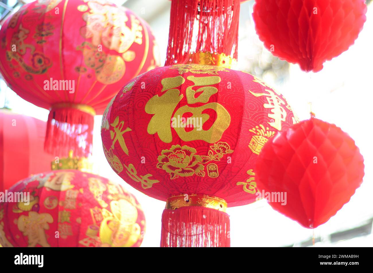 The traditional Chinese red lanterns hanging in front of people’s house ...