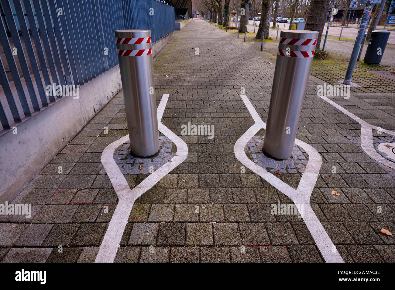 Automatic bollards, with white markings for smartphone junkies, Stuttgart, Baden-Wuerttemberg, Germany Stock Photo