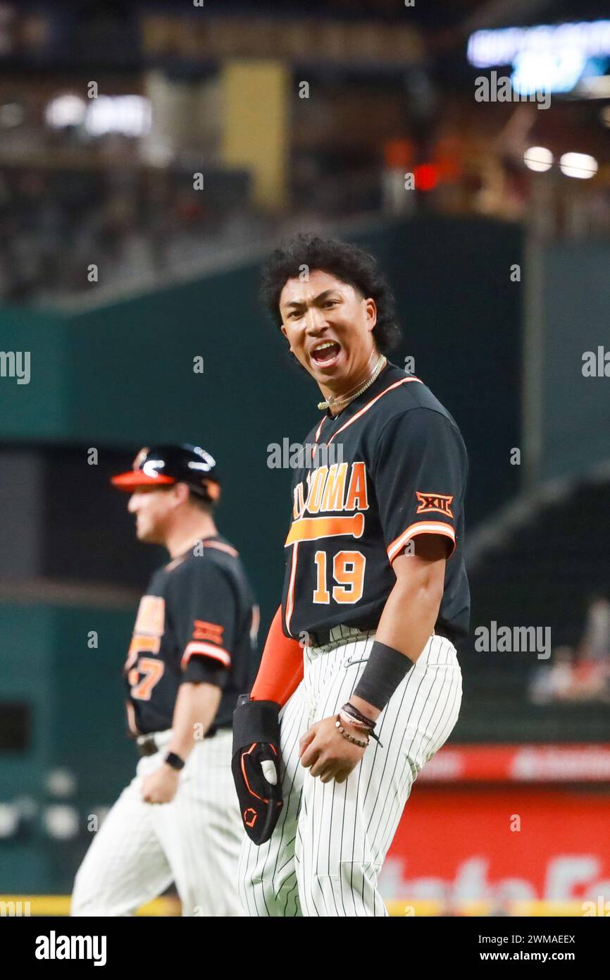 February 24, 2024: Donovan LaSalle #19 of Oklahoma State celebrates after scoring the game winning run. Oklahoma State defeated Arkansas 2-1 in 14 innings in Arlington, TX. Richey Miller/CSM Stock Photo