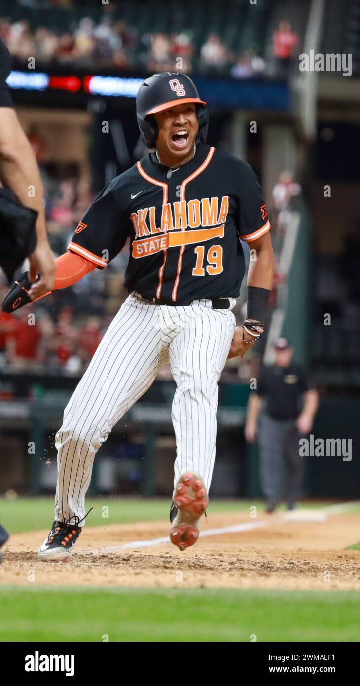 February 24, 2024: Donovan LaSalle #19 Cowboys designated hitter comes across the plate for the game winning run. Oklahoma State defeated Arkansas 2-1 in 14 innings in Arlington, TX. Richey Miller/CSM Stock Photo