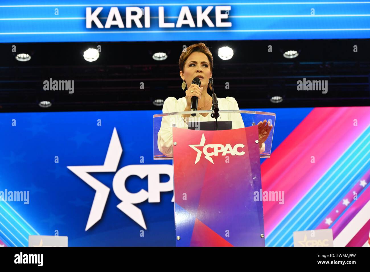 National Harbor, Maryland, USA. 24th Feb, 2024. KARI LAKE, 54, delivers remarks at the Conservative Political Action Conference, Saturday afternoon. Kari Lake Halperin is an American former television news anchor. A member of the Republican Party, she is a candidate in the 2024 United States Senate election in Arizona. She was also the Republican nominee in the 2022 Arizona gubernatorial election. Credit: ZUMA Press, Inc./Alamy Live News Stock Photo