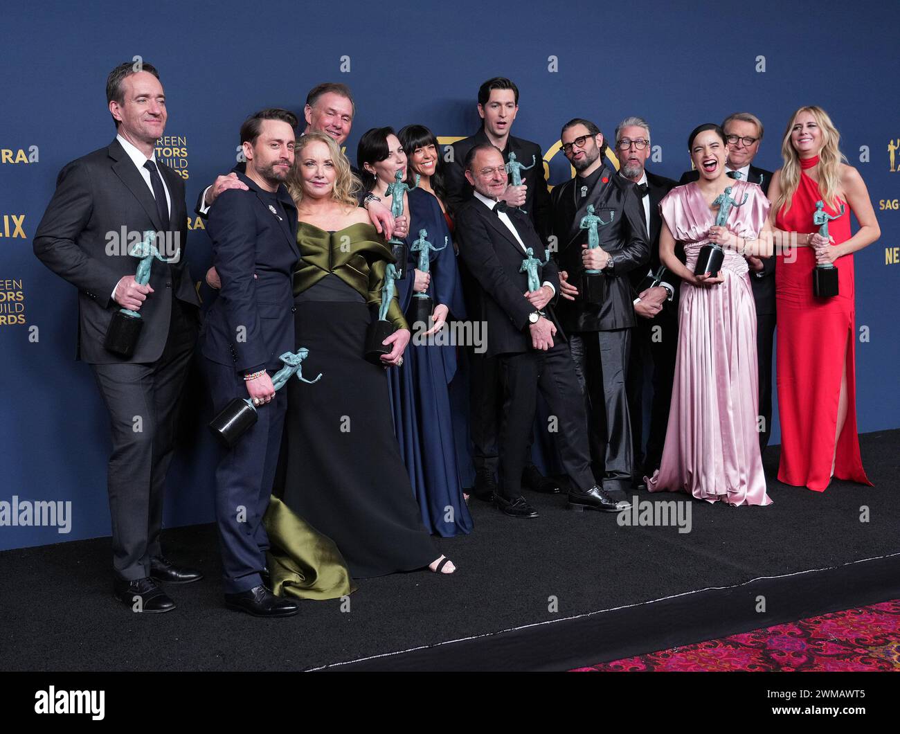 Los Angeles, USA. 24th Feb, 2024. (L-R) Matthew Macfadyen, Alexander Skarsgård, Kieran Culkin, Nicholas Braun, J. Smith-Cameron, Scott Nicholson, Zoe Winters, Dagmara Dominczyk, Arian Moayed, Fisher Stevens, Alan Ruck, Juliana Canfield, David Rasche and Justine Lupe, winners of the Outstanding Performance by an Ensemble in a Drama Series award for 'Succession' pose in the press room at the Screen Actors Guild Awards Press Room held at The Shrine Auditorium and Expo Hall in Los Angeles, CA on Saturday, ?February 24, 2024. (Photo By Sthanlee B. Mirador/Sipa USA) Credit: Sipa USA/Alamy Live News Stock Photo