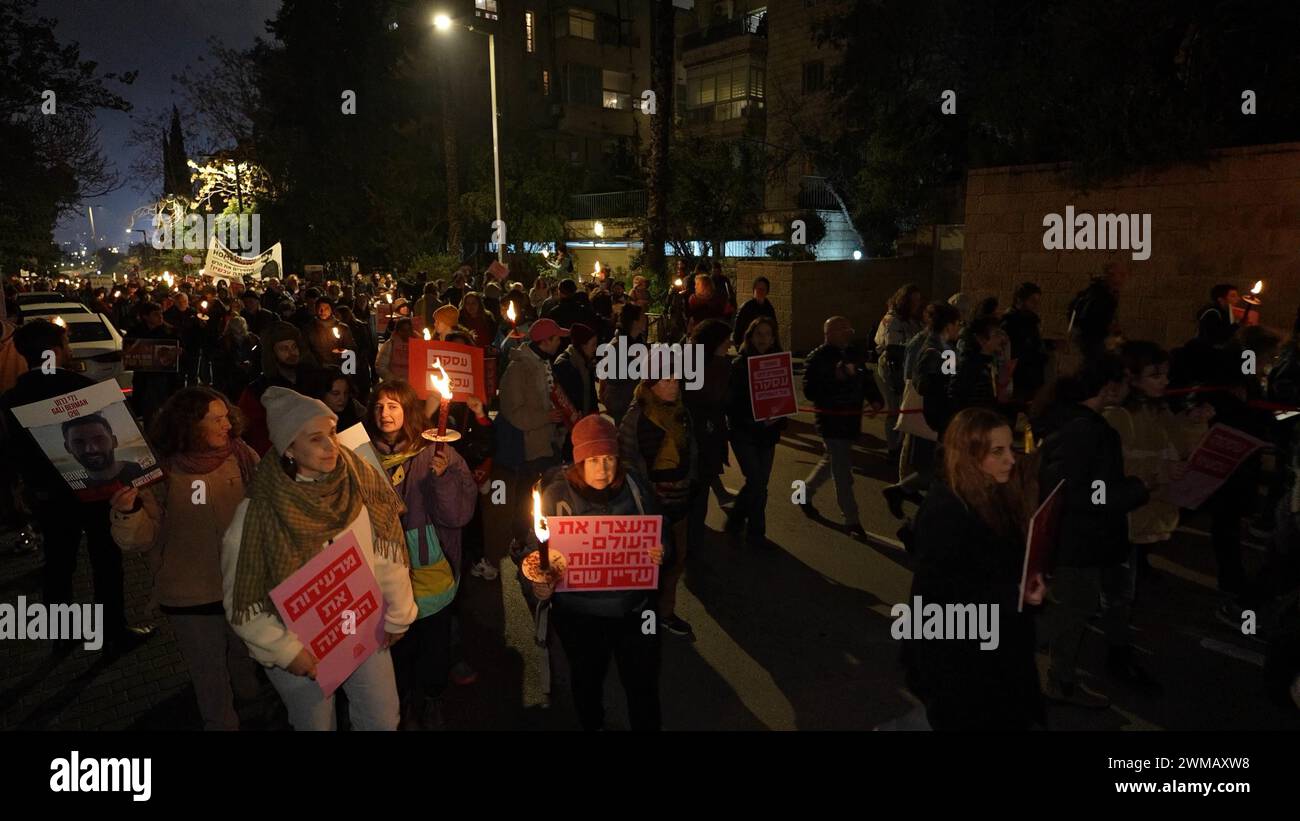Protesters hold signs and flame torches during a march from the Knesset, Israel's parliament to the official Prime Minister's residence demanding the release of hostages held by Hamas in the Gaza Strip on February 19, 2024 in Jerusalem. Israel Stock Photo