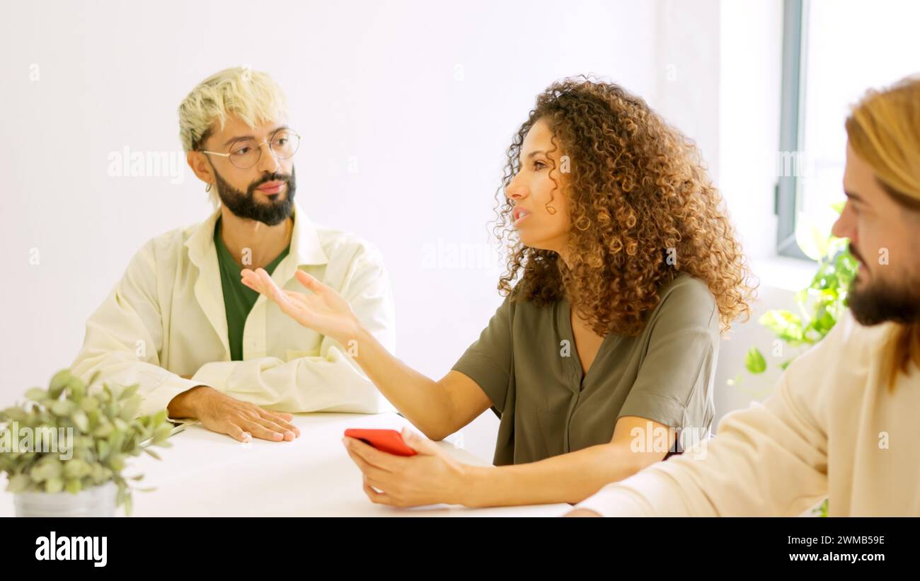 People bored during a large meeting in a coworking Stock Photo