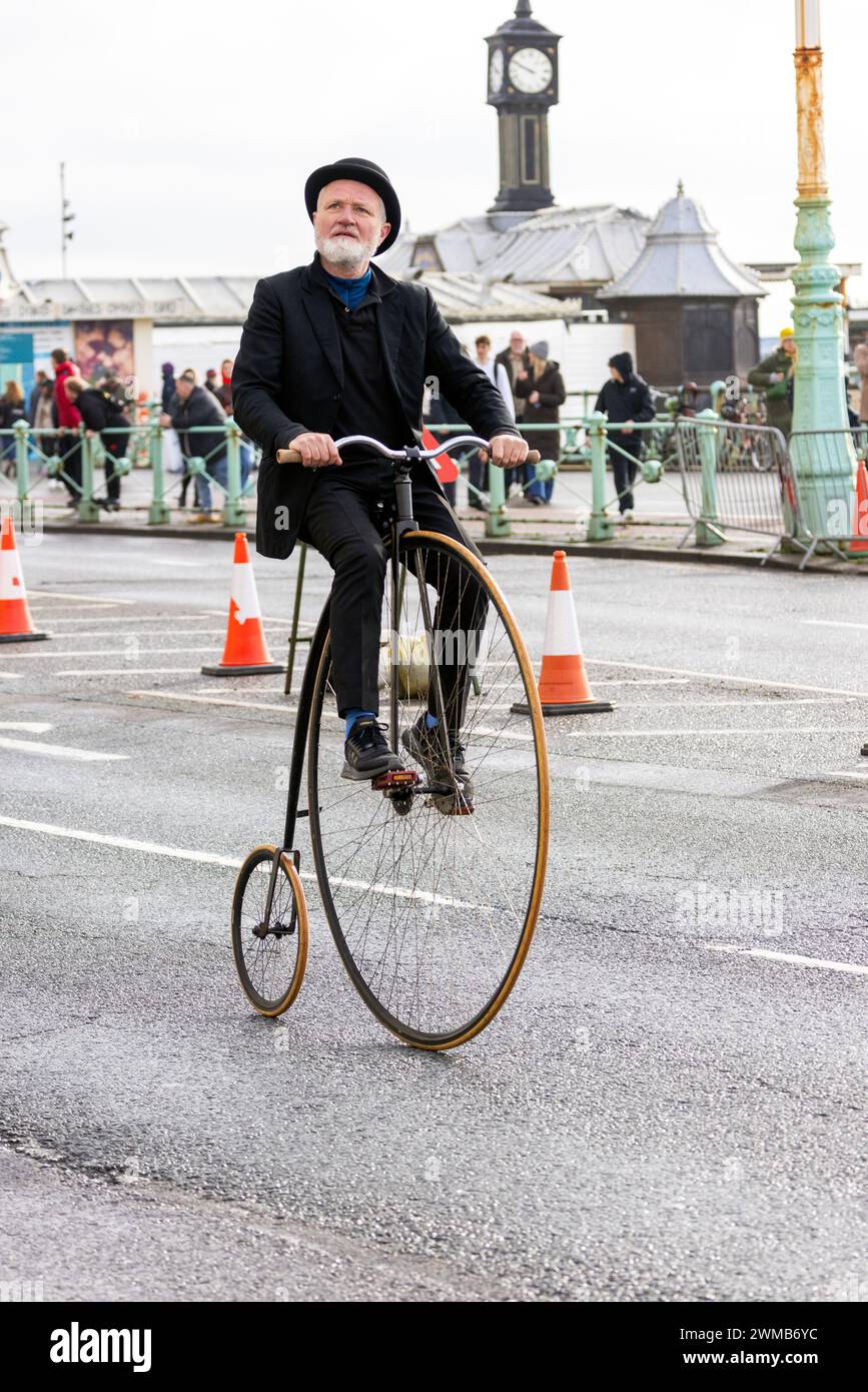 Kings Road, Brighton, City of Brighton & Hove, East Sussex, UK. Penny-farthing riders lead off on this years Brighton Half Marathon under a cloudy sky and low temperature along Brighton & Hove seafront. 25th February 2024. David Smith/Alamy Live News Stock Photo